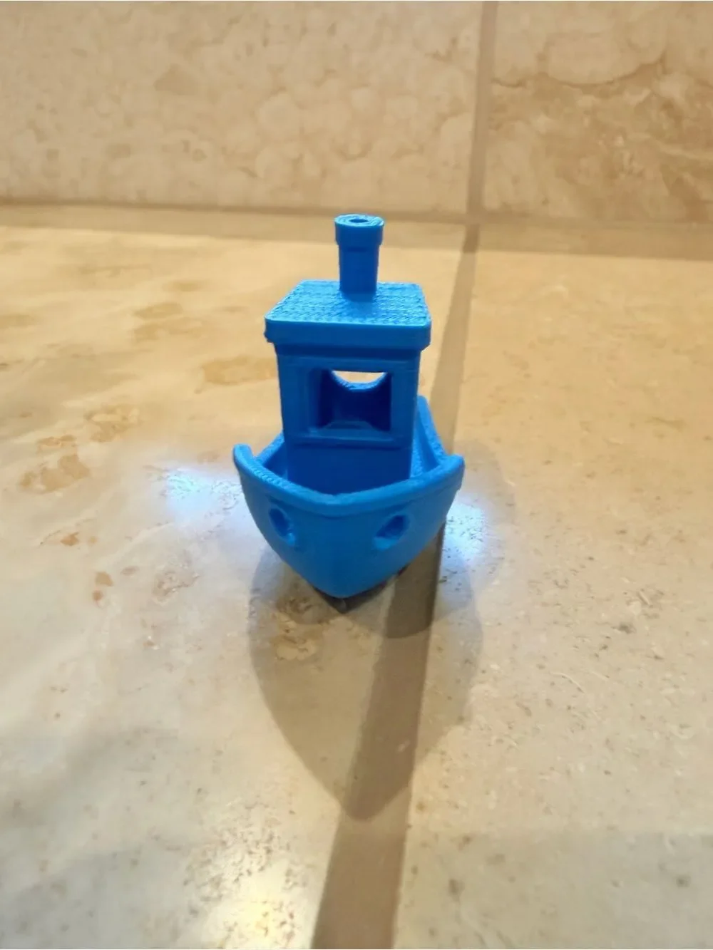 Small 3D-Printed Toy Boat in Bright Blue